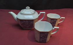 A Small Japanese Teapot And 2 Small Cups. Stamped on base.