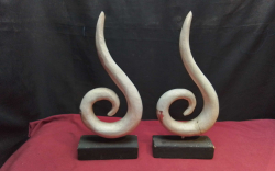 A Pair of White Art Deco  on Stands(damaged).
H.35 W.15 Cm.