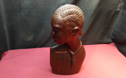 A carved hardwood African head, female, 15 inches high