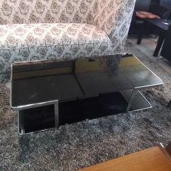 A Lovely Glass Coffee Table with Stainless Frame. 
W.60 L.130 H.35 Cm.