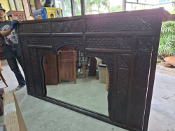 A Large Teak wood carved Wall mirror. W.210 cm H.136 cm