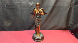 A Lovely Bronze Heavy Angel Holding A Flower. H.36 Cm.