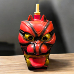 A collectible Japanese liqour bottle Red Tengu mask 