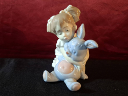 NAO fiure of a girl with a rabbits. H.13 cm