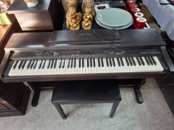 A Digital Piano with stools