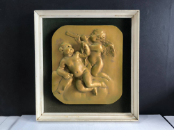 A framed beautiful gilded bas relief cherubs playing music