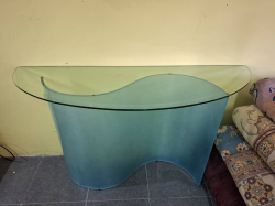 Half moon shaped blue glass top and Curved shape Table. Dimens; 134x45 cm