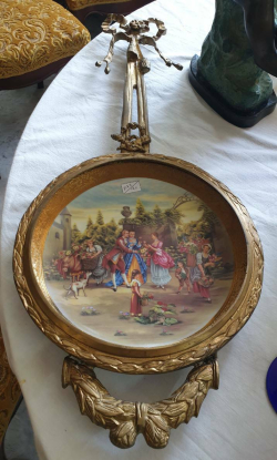 Gilt metal porcelain decorated wall plaque.
W.28 H.68 Cm.