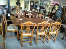 A Twin Pillar Yew wood take with 1 Leaf  (W.100 L.216 H.77 Cm)And  8 Hepplewhite Chairs including 2 Carvers in Excellent Condition. (65)